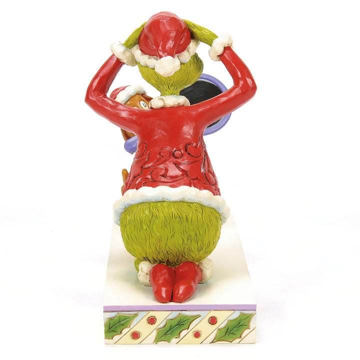Max Holding a Mirror for the Grinch Figurine